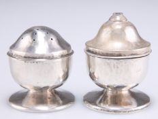 A PAIR OF ARTS AND CRAFTS SILVER SALT AND PEPPER POTS