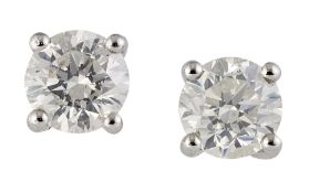 A PAIR OF SOLITAIRE DIAMOND EARRINGS