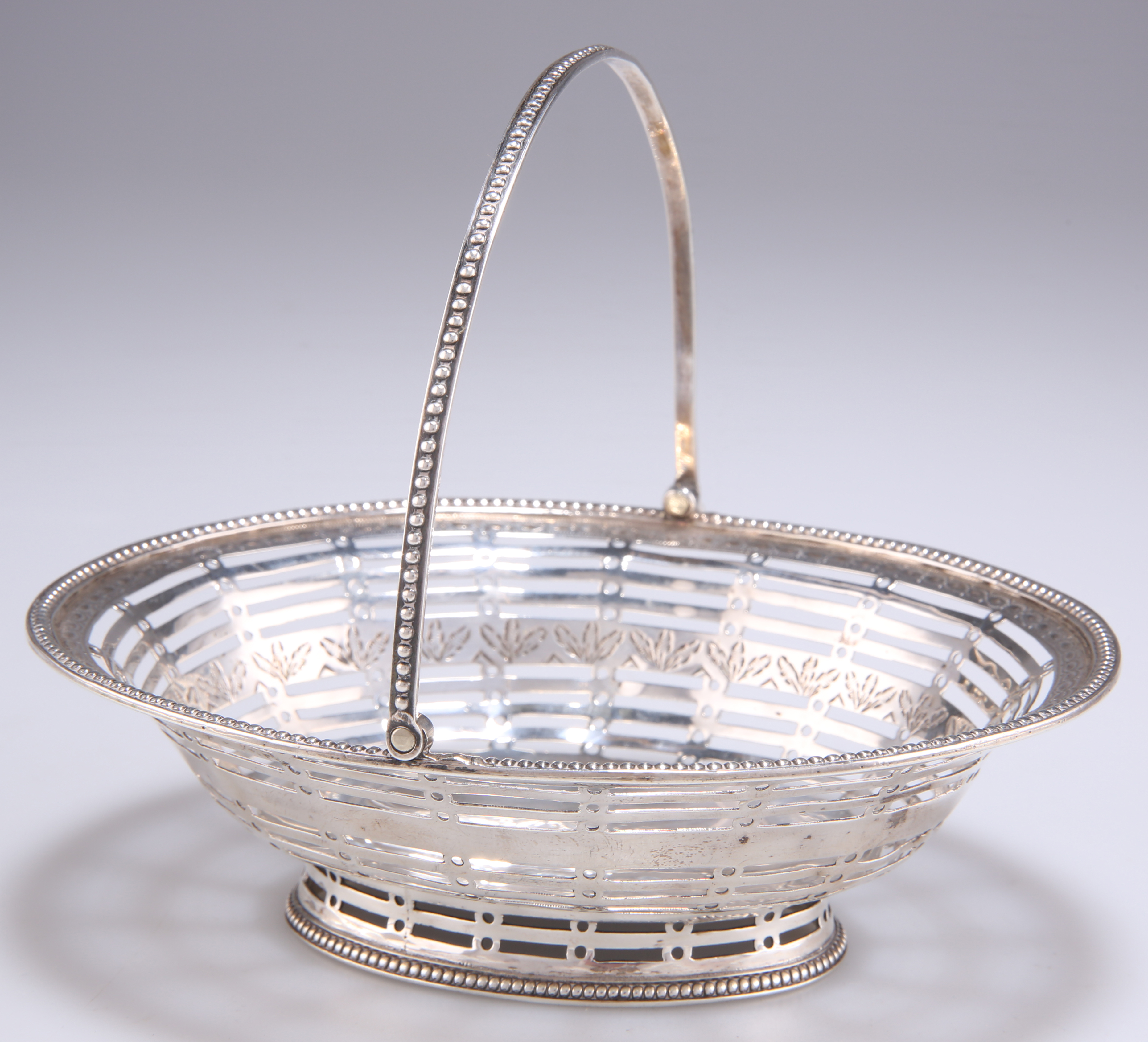 A GEORGE III SILVER SMALL BASKET