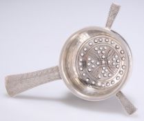 AN ARTS AND CRAFTS SILVER TEA STRAINER