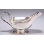 A GEORGE VI SILVER SAUCE BOAT