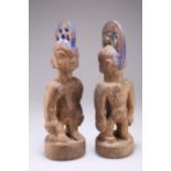 A PAIR OF NIGERIAN YORUBA 'ERE IBEJI' TWIN MALE CARVED WOODEN FIGURES, EARLY 20TH CENTURY