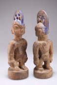 A PAIR OF NIGERIAN YORUBA 'ERE IBEJI' TWIN MALE CARVED WOODEN FIGURES, EARLY 20TH CENTURY