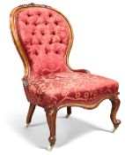 A VICTORIAN WALNUT AND UPHOLSTERED NURSING CHAIR