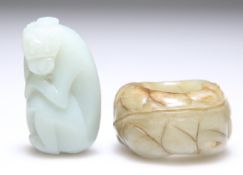 A JADE THUMB RING AND A CARVING