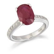 AN 18 CARAT WHITE GOLD RUBY AND DIAMOND RING