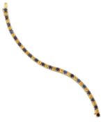 A BLUE AND YELLOW SAPPHIRE LINE BRACELET