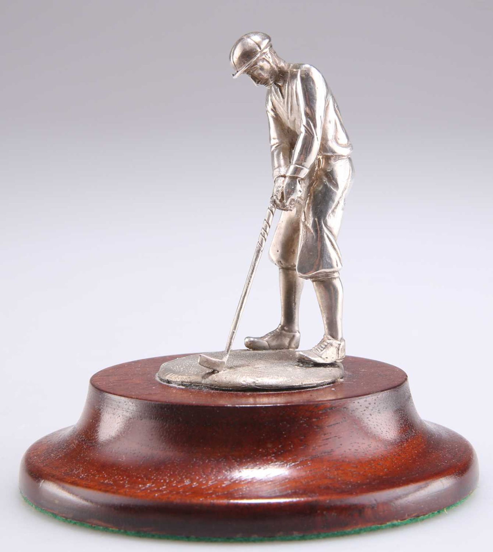 AN ELIZABETH II SILVER FIGURE OF A GOLFER