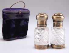 A VICTORIAN SILVER-GILT AND GLASS DOUBLE-ENDED COMBINED SCENT, SMELLING BOTTLE AND VINAIGRETTE