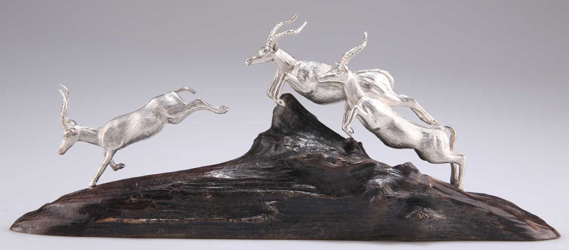 PATRICK MAVROS: IMPALAS LEAPING TRIO, A STERLING SILVER SCULPTURE