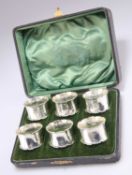 A SET OF SIX GEORGE V SILVER NAPKIN RINGS