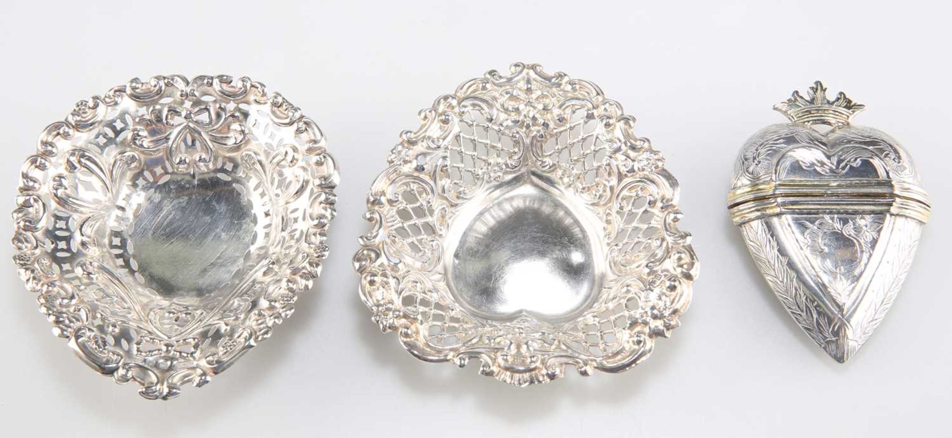 A CONTINENTAL SILVER AND SILVER-GILT MARRIAGE BOX AND TWO PIERCED SILVER TRINKET DISHES