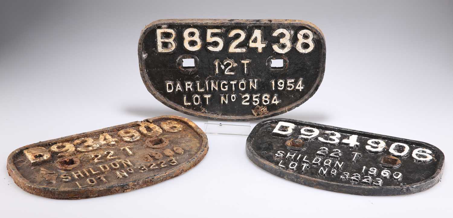 THREE CAST IRON WAGON PLATES