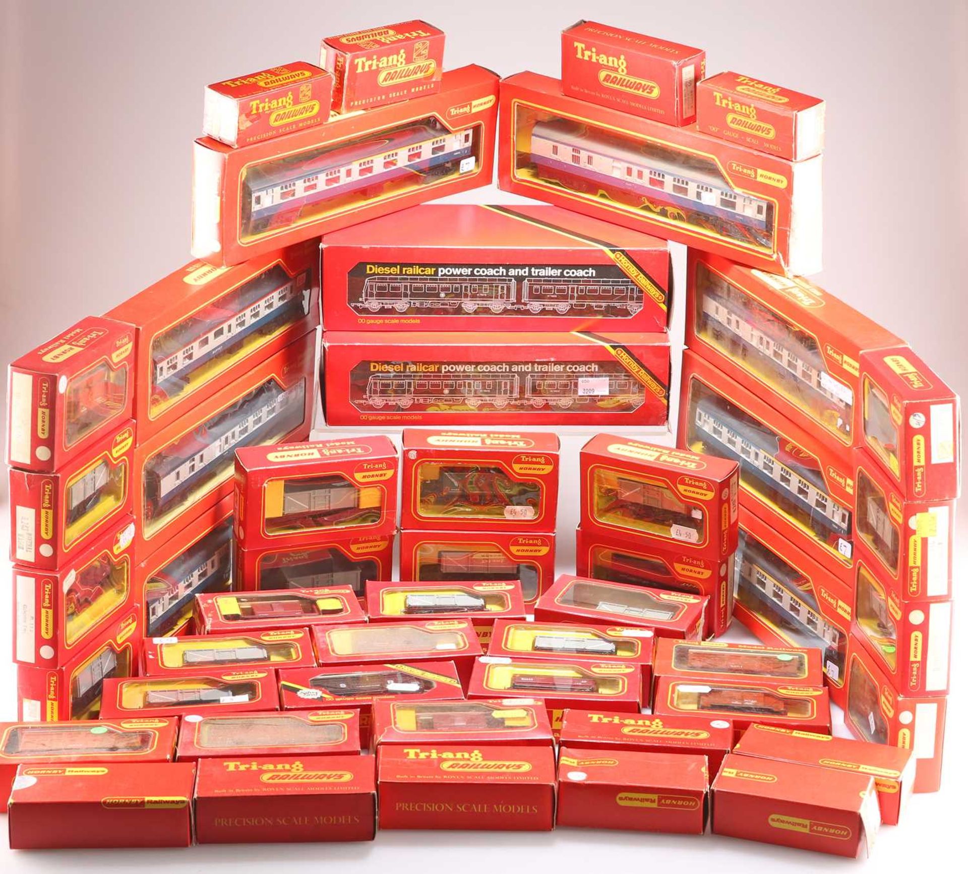 A GROUP OF APPROXIMATELY FORTY-NINE HORNBY AND TRI-ANG BOXED COACHES AND VANS