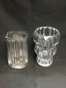 A ROGASKA CRYSTAL CLEAR GLASS VASE, 25cm high; and A FLUTED CLEAR GLASS VASE, 22.5cm high. (2)