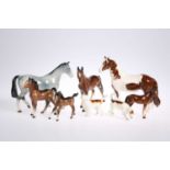 A BESWICK PINTO PONY, TWO FOALS, TWO HOUNDS, ETC.