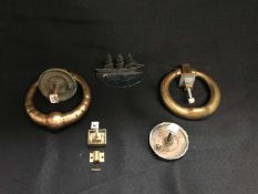 TWO BRASS DOOR KNOCKERS, AND A METAL SHIP MODEL