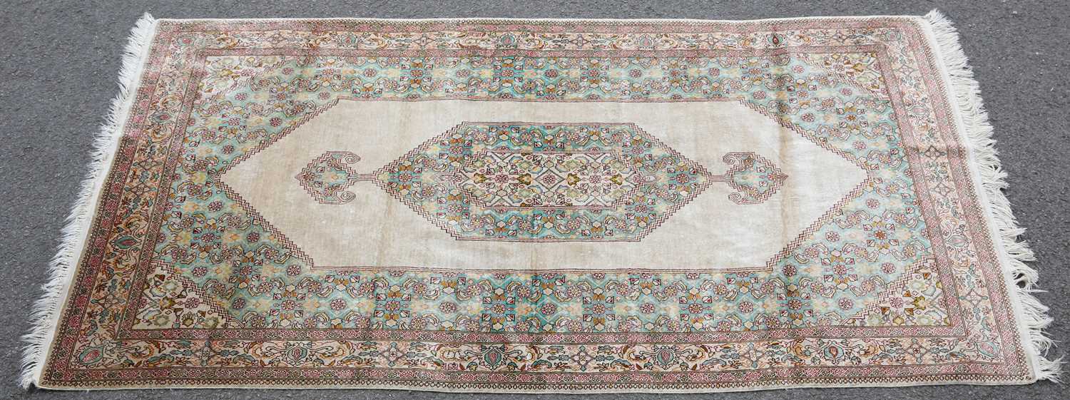 A NEAR PAIR OF SILK KASHMIR RUGS