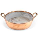 A COPPER TWO-HANDLED CREAM PAN