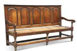 AN 18TH CENTURY OAK SETTLE