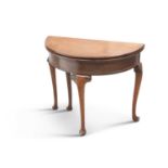 A GEORGE II STYLE MAHOGANY DEMILUNE FOLDOVER TEA TABLE