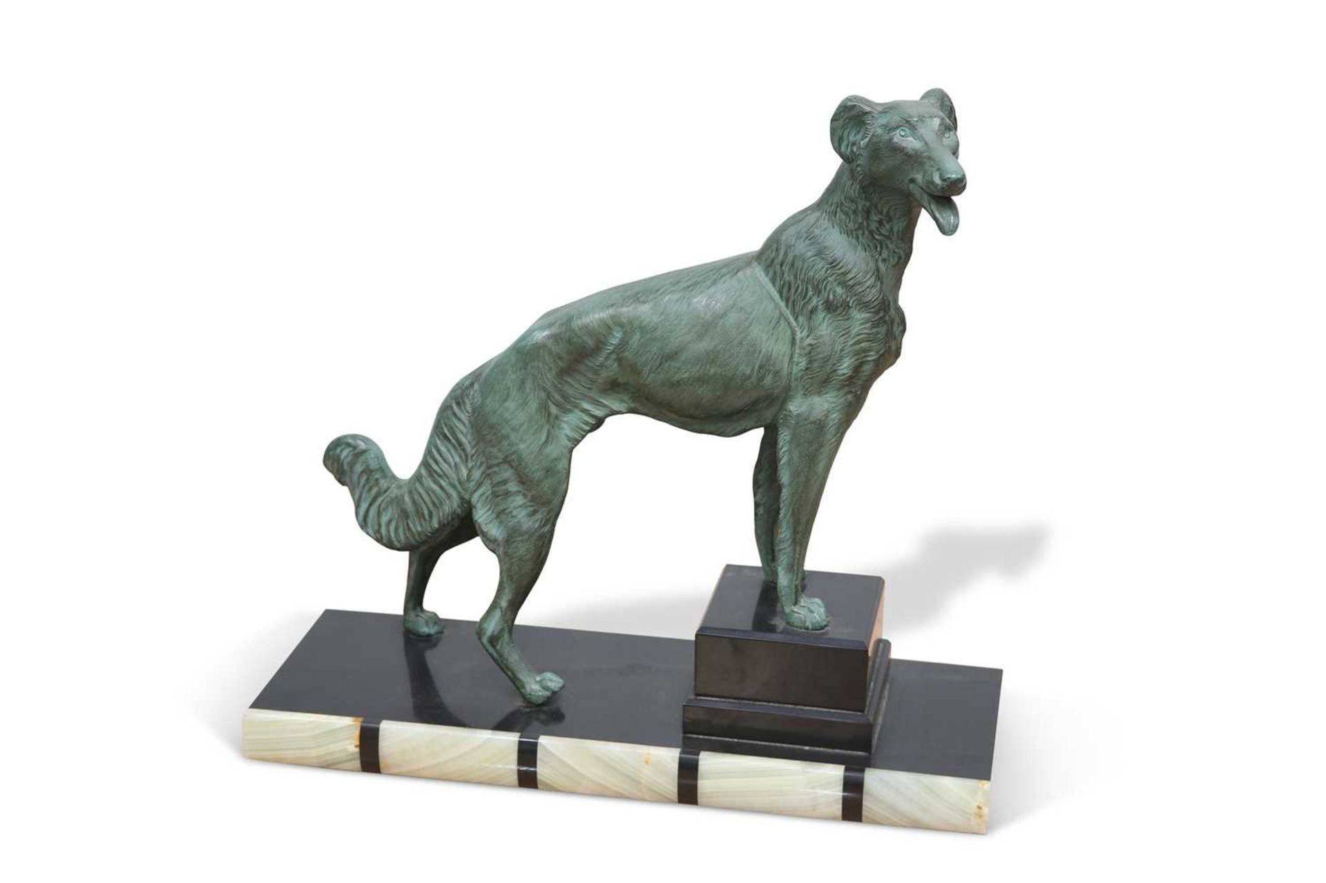 AN ART DECO STYLE PATINATED SPELTER MODEL OF A DOG
