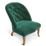 A VICTORIAN WALNUT AND UPHOLSTERED NURSING CHAIR