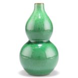 A CHINESE MONOCHROME APPLE-GREEN GOURD VASE