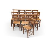 A GROUP OF TWELVE BEECH AND OAK CHAPEL CHAIRS, LATE 19TH/EARLY 20TH CENTURY