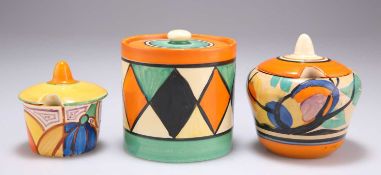 TWO CLARICE CLIFF PRESERVE POTS AND A CONDIMENT POT