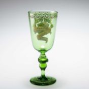 A LATE 19TH CENTURY ARMORIAL GREEN GLASS GOBLET