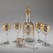 A LATE GEORGE III GILDED GLASS DECANTER AND FIVE GLASSES