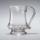 AN 18TH CENTURY GLASS MUG