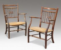 A PAIR OF BEECH AND RUSH-SEATED OPEN ARMCHAIRS, CIRCA 1900