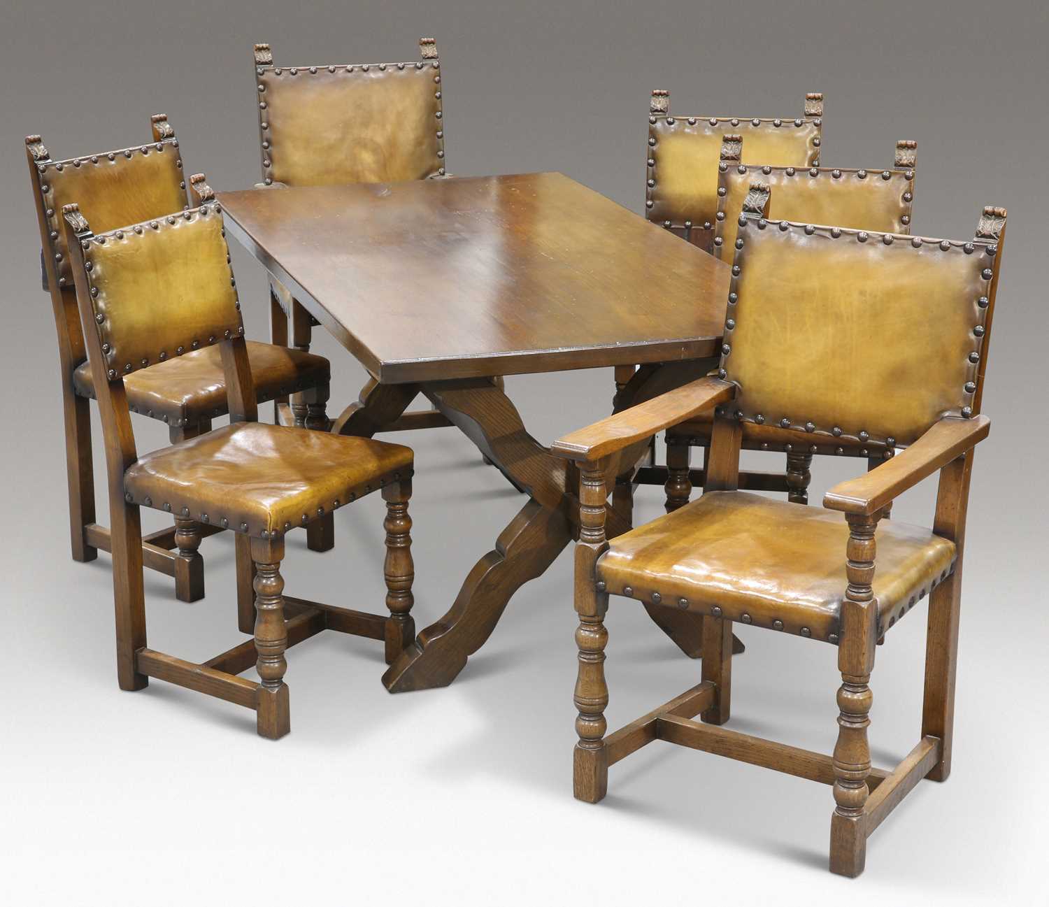 A PERIOD STYLE OAK REFECTORY DINING TABLE AND SIX CHAIRS