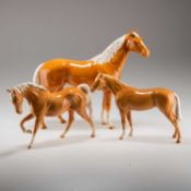 A GROUP OF PALOMINO BESWICK HORSES