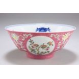 A CHINESE PINK-GROUND FAMILLE ROSE 'MEDALLION' BOWL