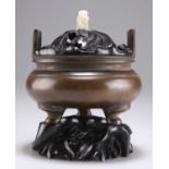 A CHINESE PATINATED BRONZE CENSER