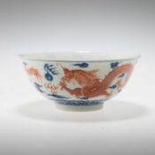 A CHINESE UNDERGLAZE BLUE AND IRON-RED DECORATED 'DRAGON' BOWL