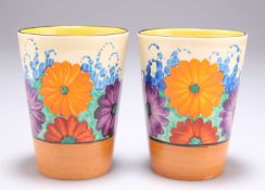 A PAIR OF CLARICE CLIFF BIZARRE GAYDAY PATTERN BEAKERS