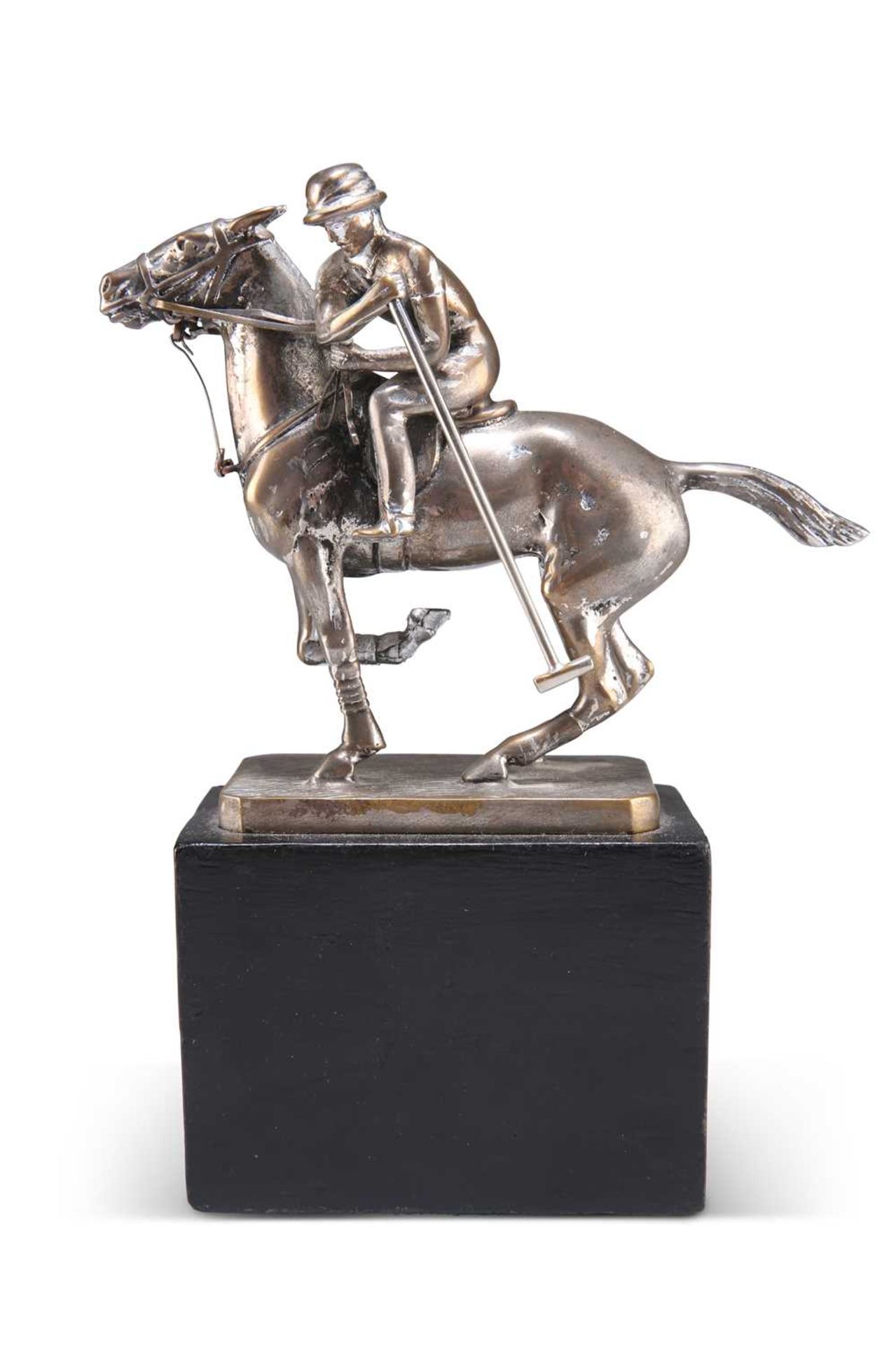 A CHROME-PLATED FIGURE OF A POLO PLAYER ON HORSEBACK