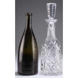 A MID-19TH CENTURY GREEN GLASS WINE BOTTLE AND A WATERFORD CUT-GLASS DECANTER AND STOPPER