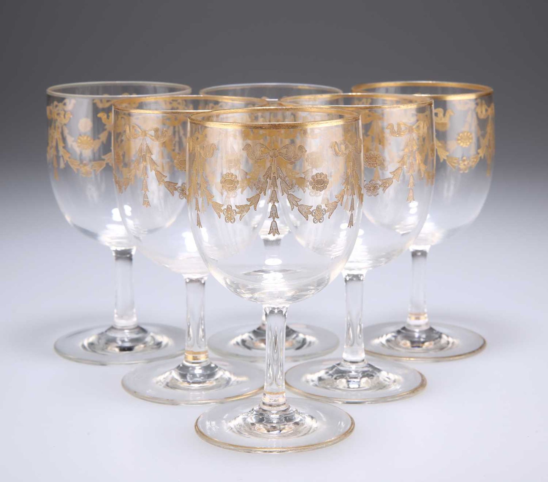 A SET OF SIX GILDED DRINKING GLASSES, LATE 19TH CENTURY,