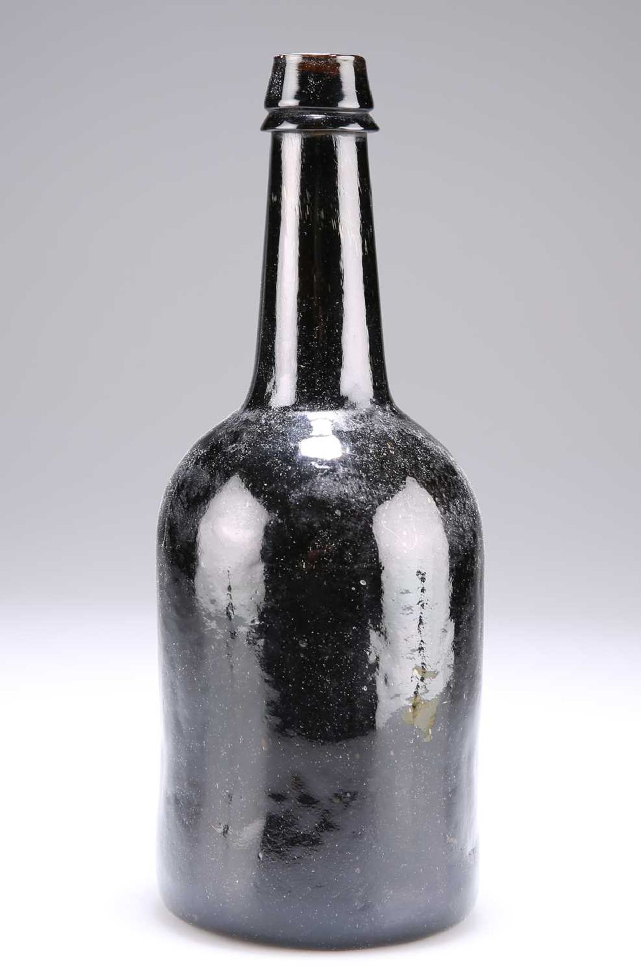 A BROWN GLASS BOTTLE