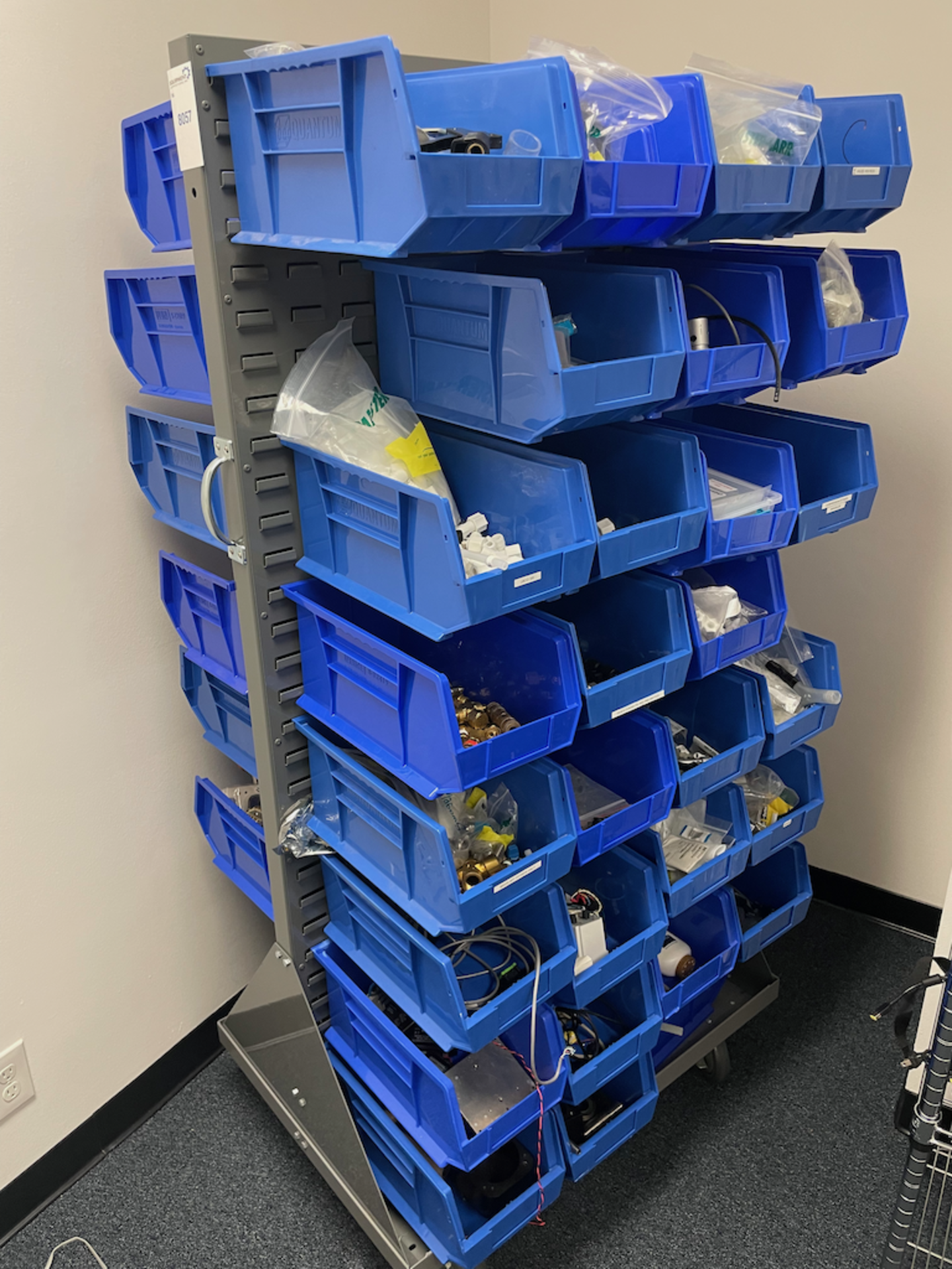 PORTABLE ULINE PARTS RACK WITH CONTENTS OF BLUE TOTES