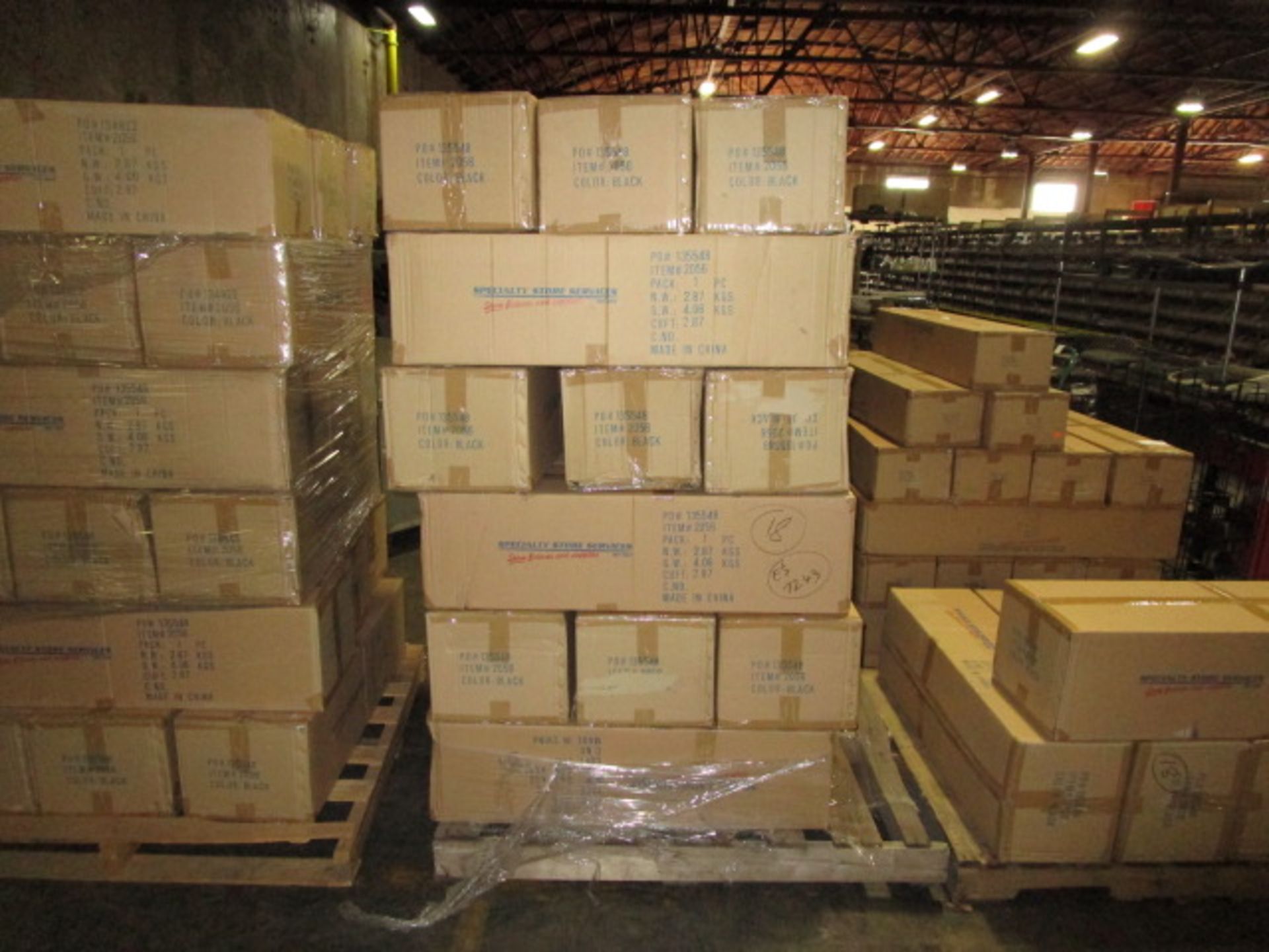 PALLET CONTAINING CONTENTS OF MAGAZINE RACKS