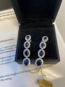 14kt white gold cast & assembled graduating blue sapphire & diamond dangle earrings