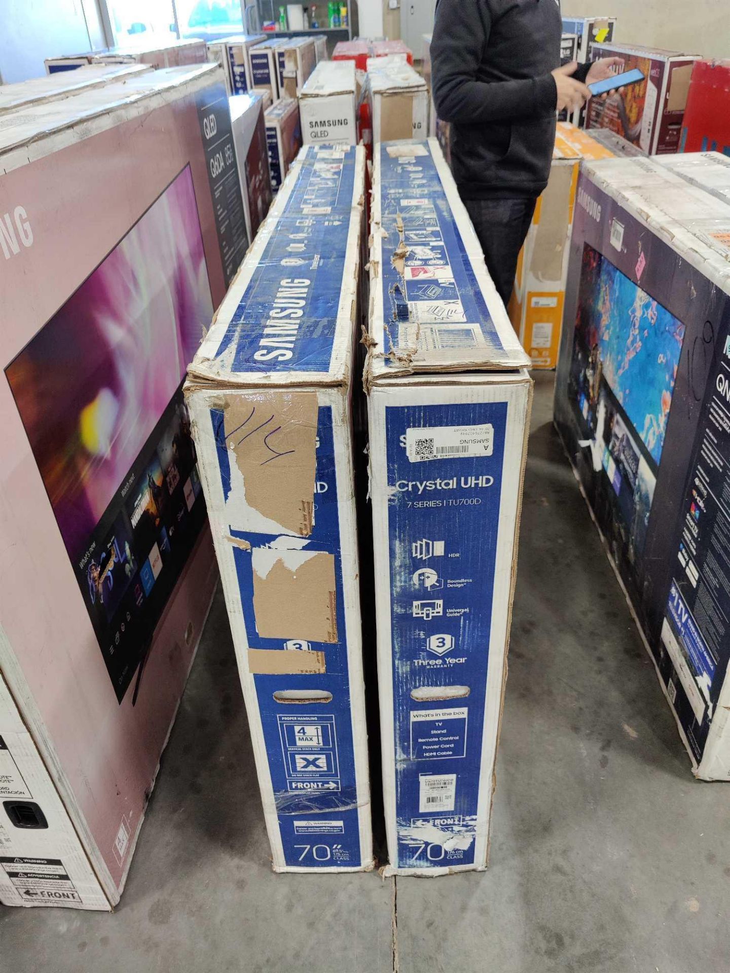 two Samsung 70-in TVs