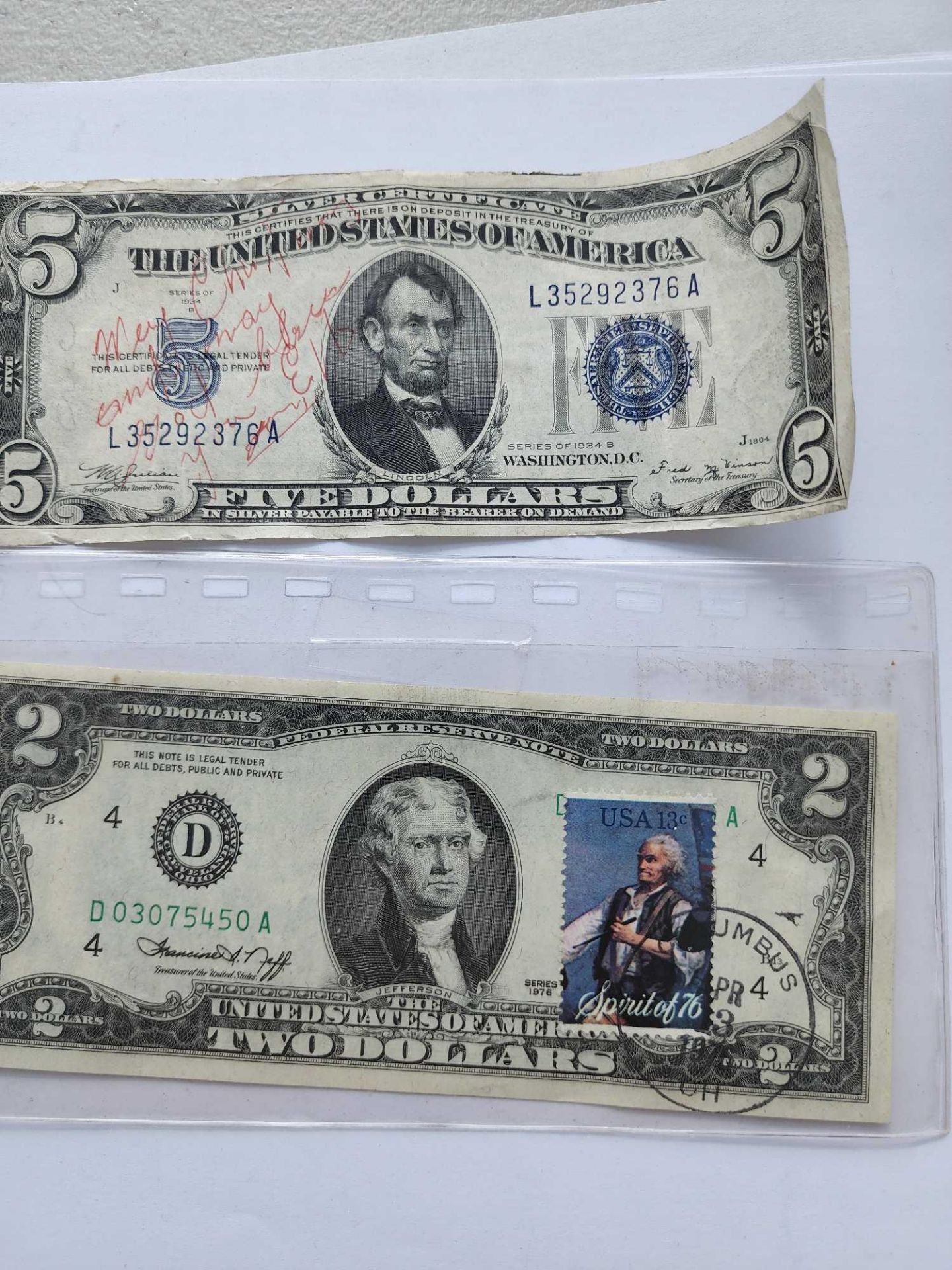 2 dollar with stamp and 1934 5 dollar bill