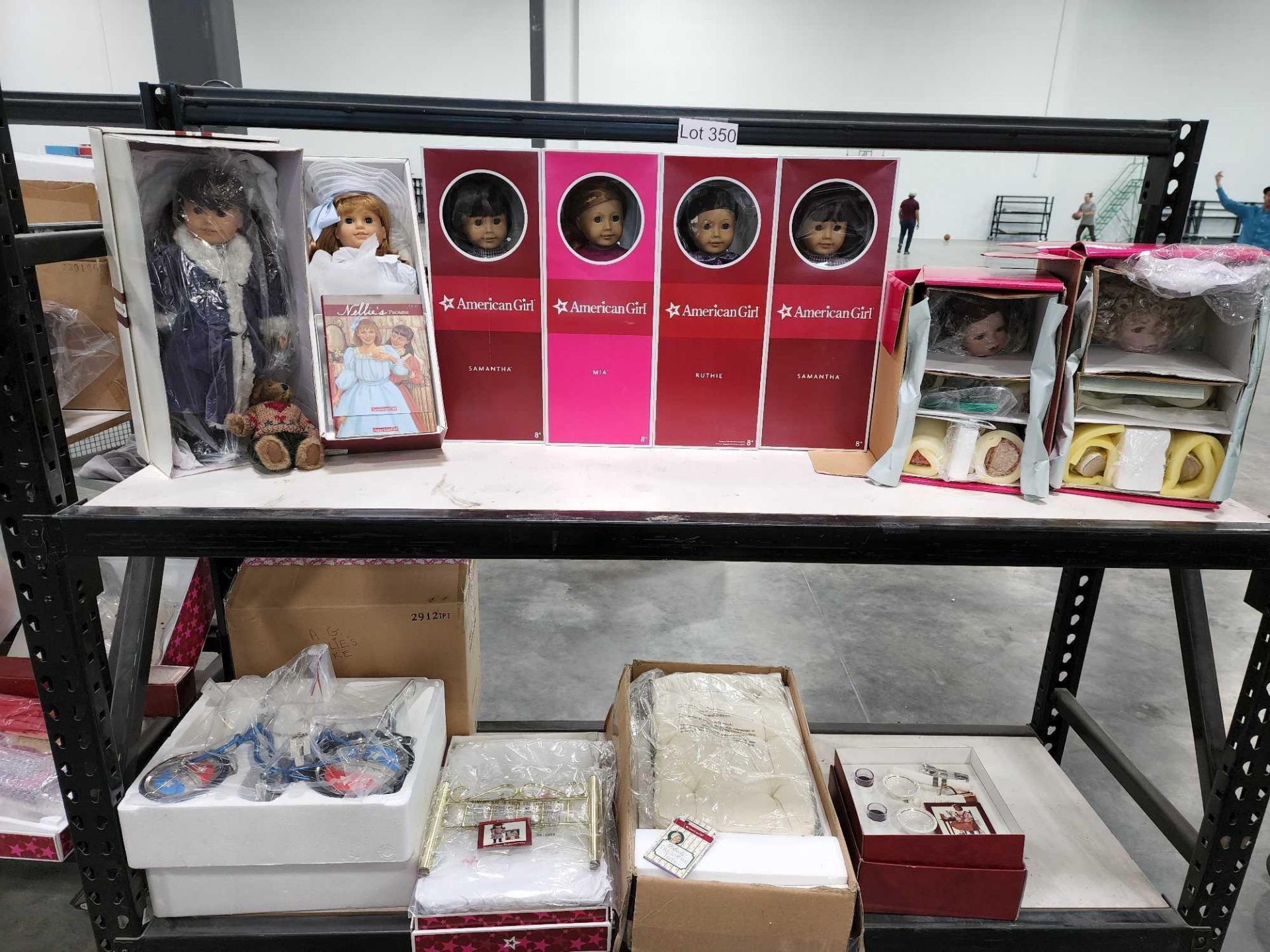 rolling rack of American girl dolls